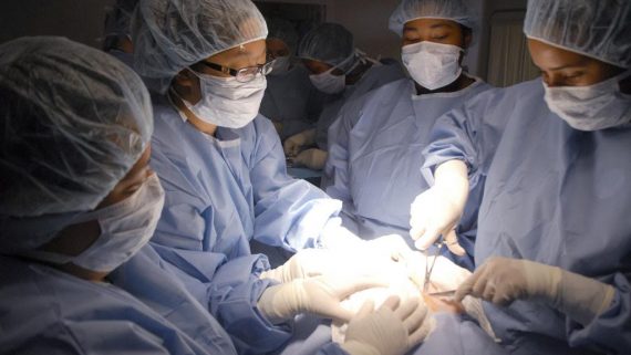 medical students practice performing surgery together